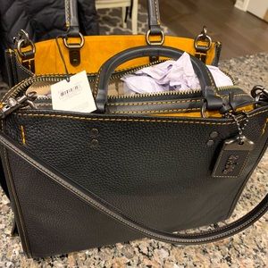 Black Rogue Coach bag. New with tags.